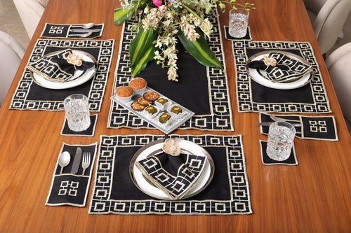 Black linen embroidered cutlery holder.