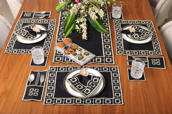 Black linen embroidered cutlery holder.