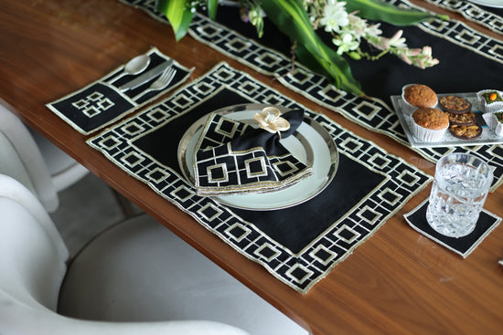 Black linen embroidered coaster.