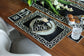 Black linen embroidered coaster.