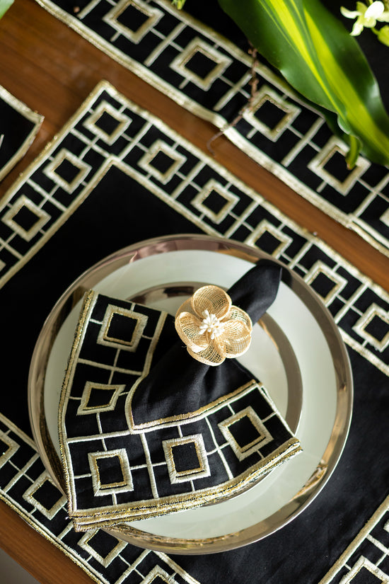 Black linen embroidered placemat and napkin.