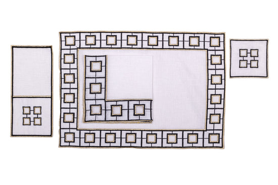 White linen embroidered cutlery holder.