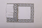 White linen embroidered placemat and napkin.