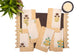 Brown linen placemat with striped flange and printed linen napkin.