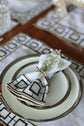 White linen embroidered placemat and napkin.