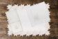 Powder blue linen placemat and napkin with silver cutwork embroidered.