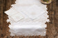 Powder blue linen placemat and napkin with silver cutwork embroidered.