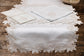 Powder blue linen silver cutwork runner.