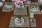 Brown linen runner with gold cutwork embroidery.