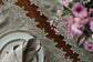 Brown linen placemats and napkins with gold  cutwork embroidery.