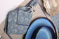 Natural linen placemats with blue peacock print linen napkin.