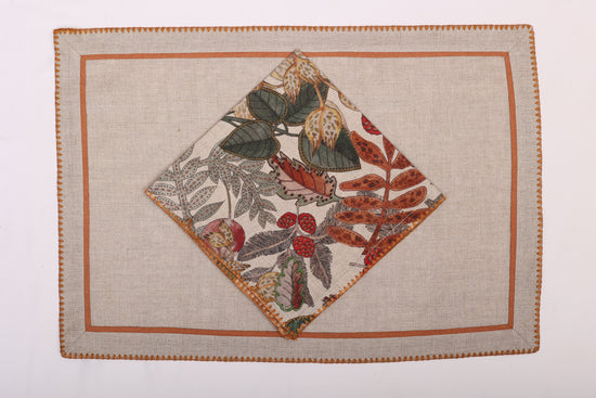 Natural linen embroidered placemats and printed linen napkin.