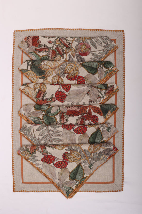 Natural linen embroidered placemats and printed linen napkin.