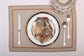 Natural linen embroidered placemats and printed linen napkin.