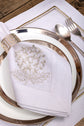 White linen placemats and napkins with gold hydrangea.