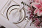 White linen placemats and napkins with gold hydrangea.