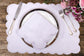White linen placemat and napkin embroidered.