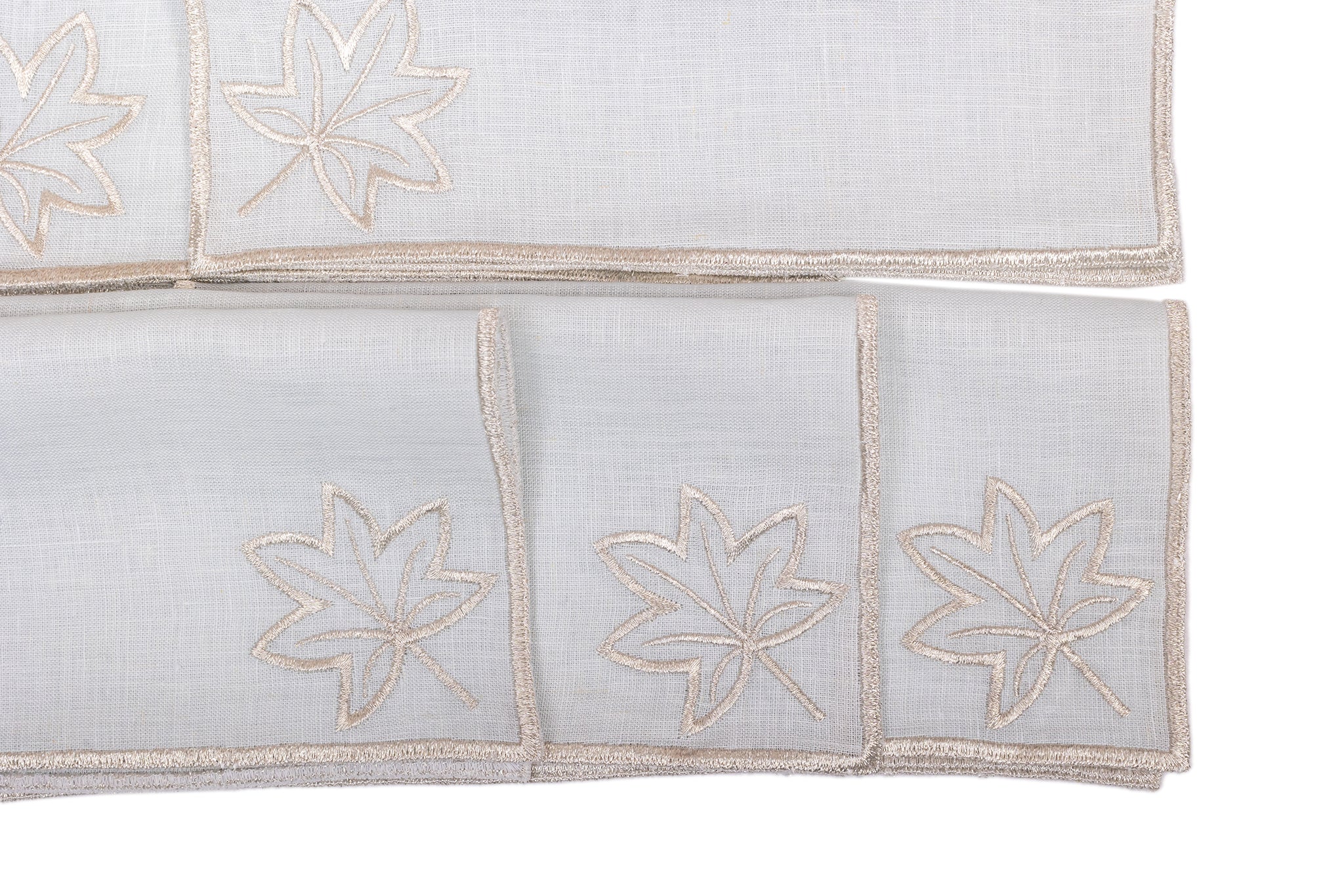 Powder blue linen silver maple leaf embroidered cocktail napkin.