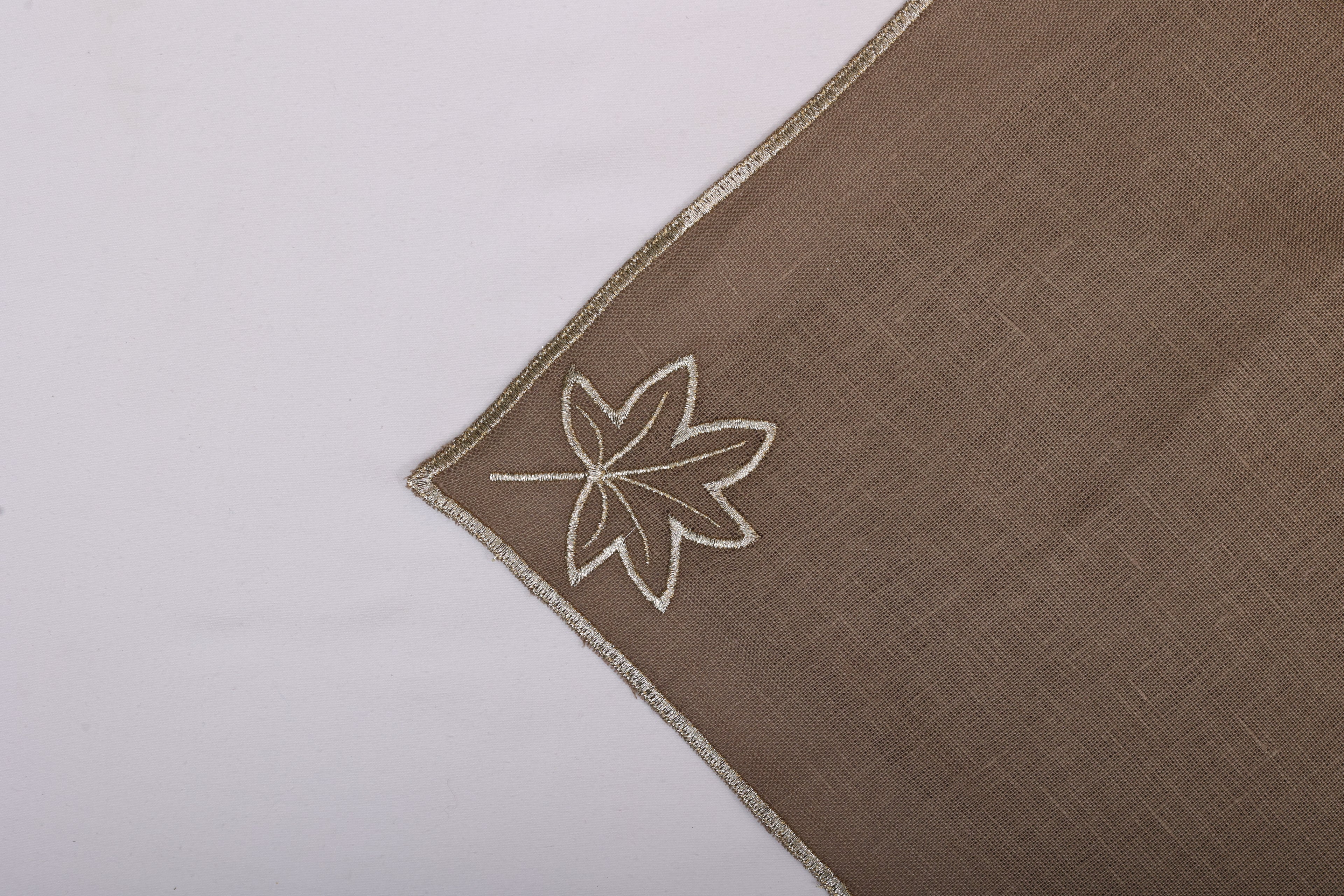 Brown linen maple leaf embroidered cocktail napkin.