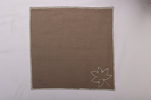 Brown linen maple leaf embroidered cocktail napkin.