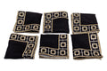 Black linen embroidered cocktail napkin.