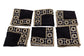 Black linen embroidered cocktail napkin.