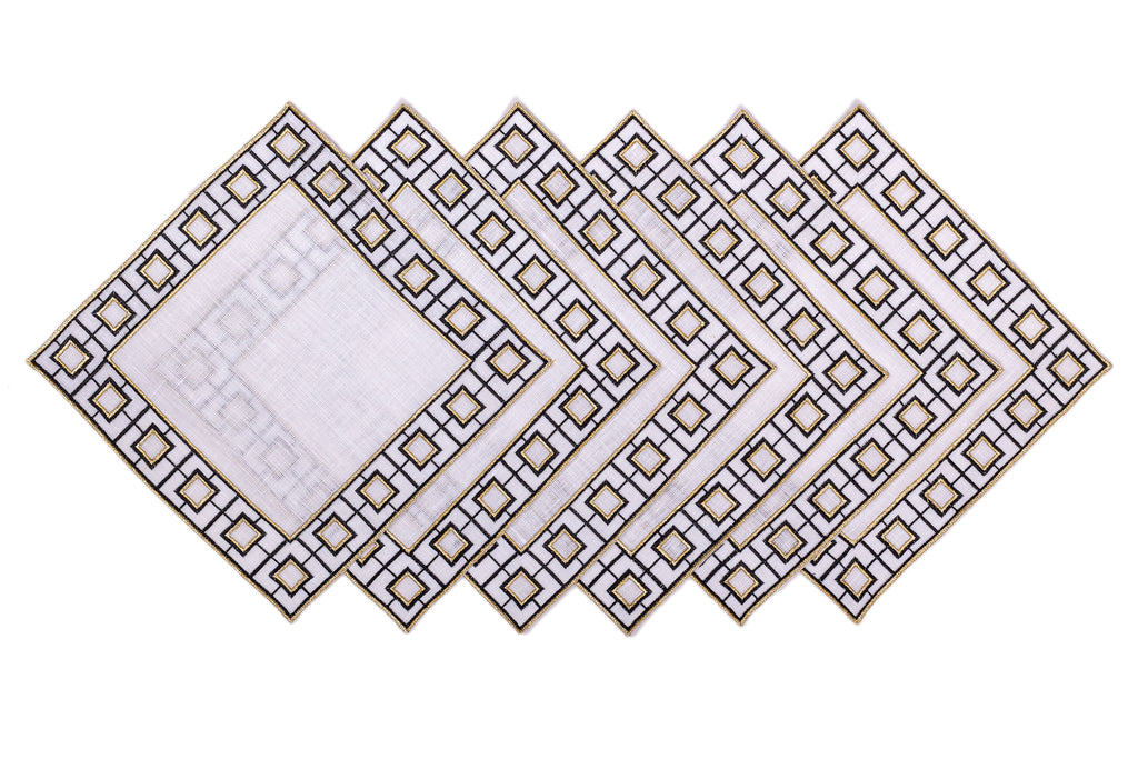 White linen embroidered cocktail napkin.