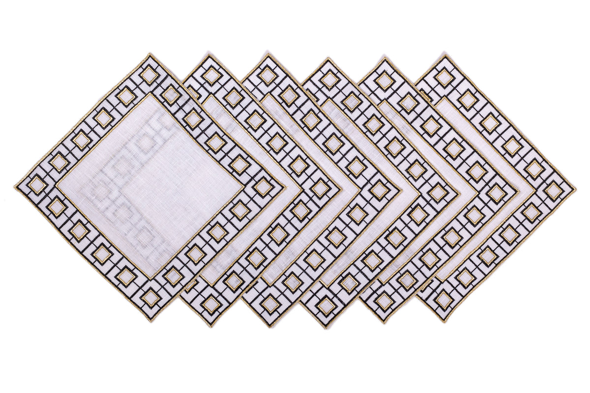 White linen embroidered cocktail napkin.