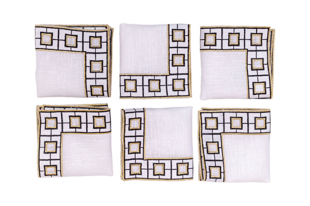 White linen embroidered cocktail napkin.