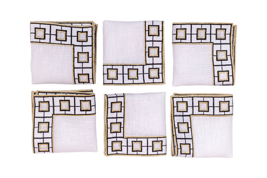 White linen embroidered cocktail napkin.