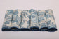 White linen blue leaves printed cocktail napkin.