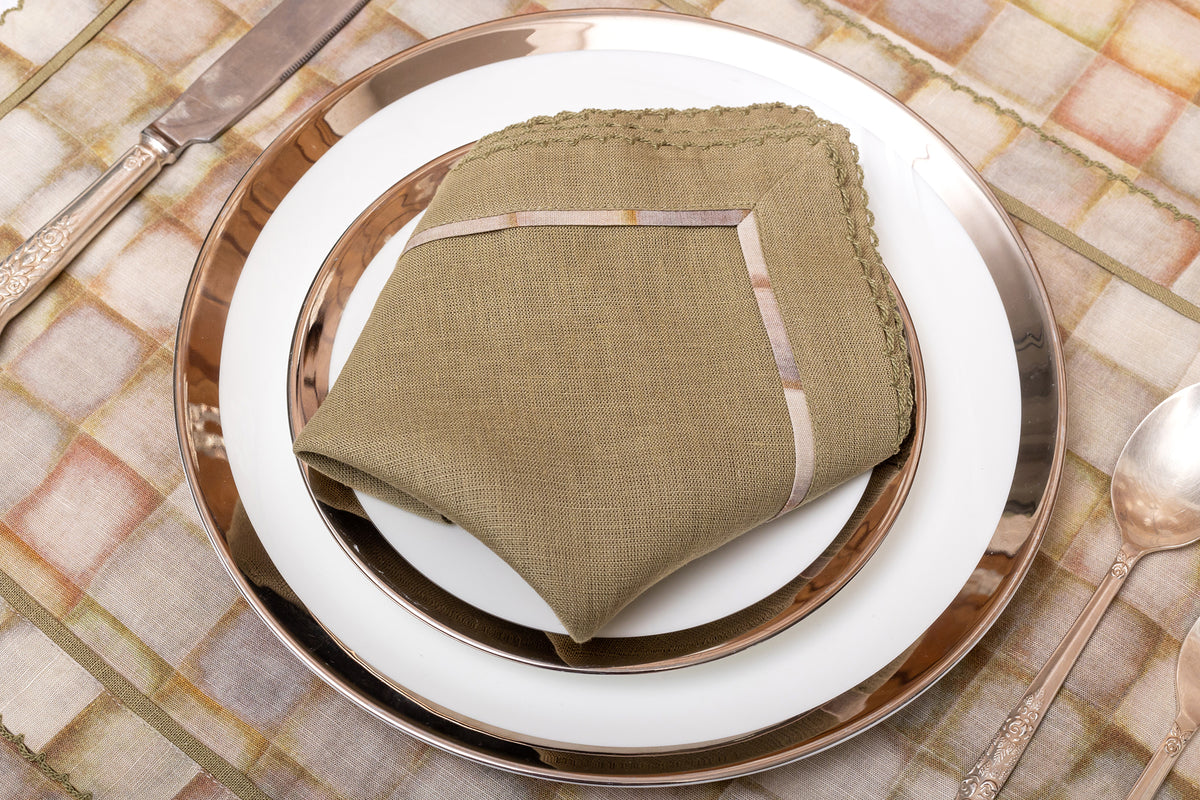 Olive green linen printed placemats with olive green linen napkin.