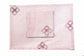 Pink striped placemats and napkins with embroidery.