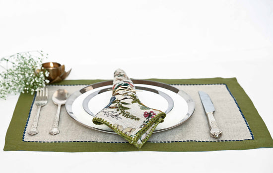 Natural linen embroidered placemats with olive green printed linen  napkins.