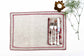 Natural linen placemats with embroidery and floral printed napkins.