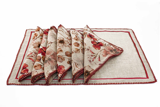 Natural linen placemats with embroidery and floral printed napkins.