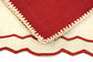 Natural linen  placemats with maroon embroidery and  with  maroon linen  embroidered  napkins.