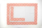 White linen placemats and napkins with pink  block print.