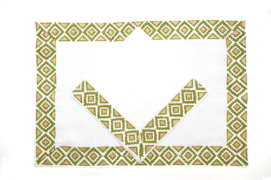 White linen placemats and napkins with olive  block print.