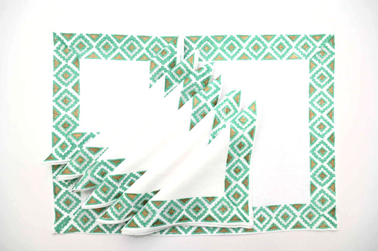 White linen placemats and napkins with turquoise  block print.