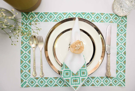 White linen placemats and napkins with turquoise  block print.