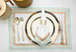 White linen placemats and napkins with delicate turquoise block print