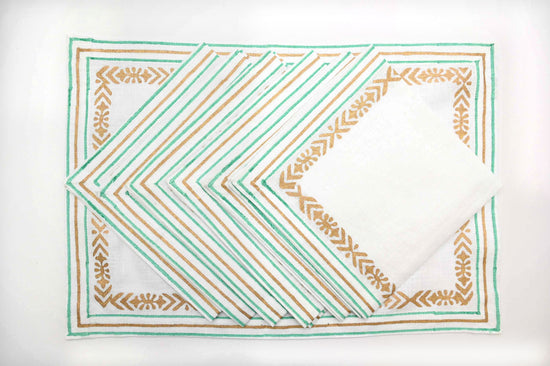 White linen placemats and napkins with delicate turquoise block print