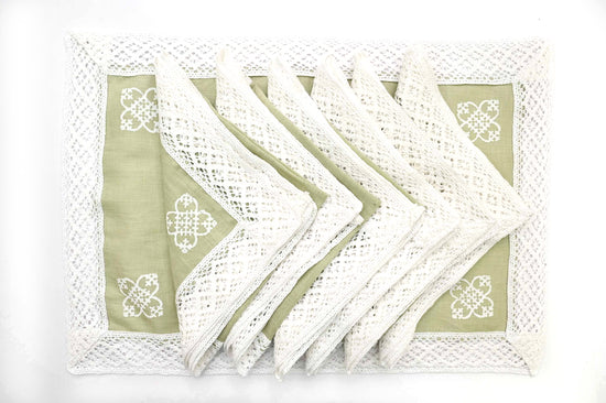 Lime green linen placemats with linen napkins with lace.