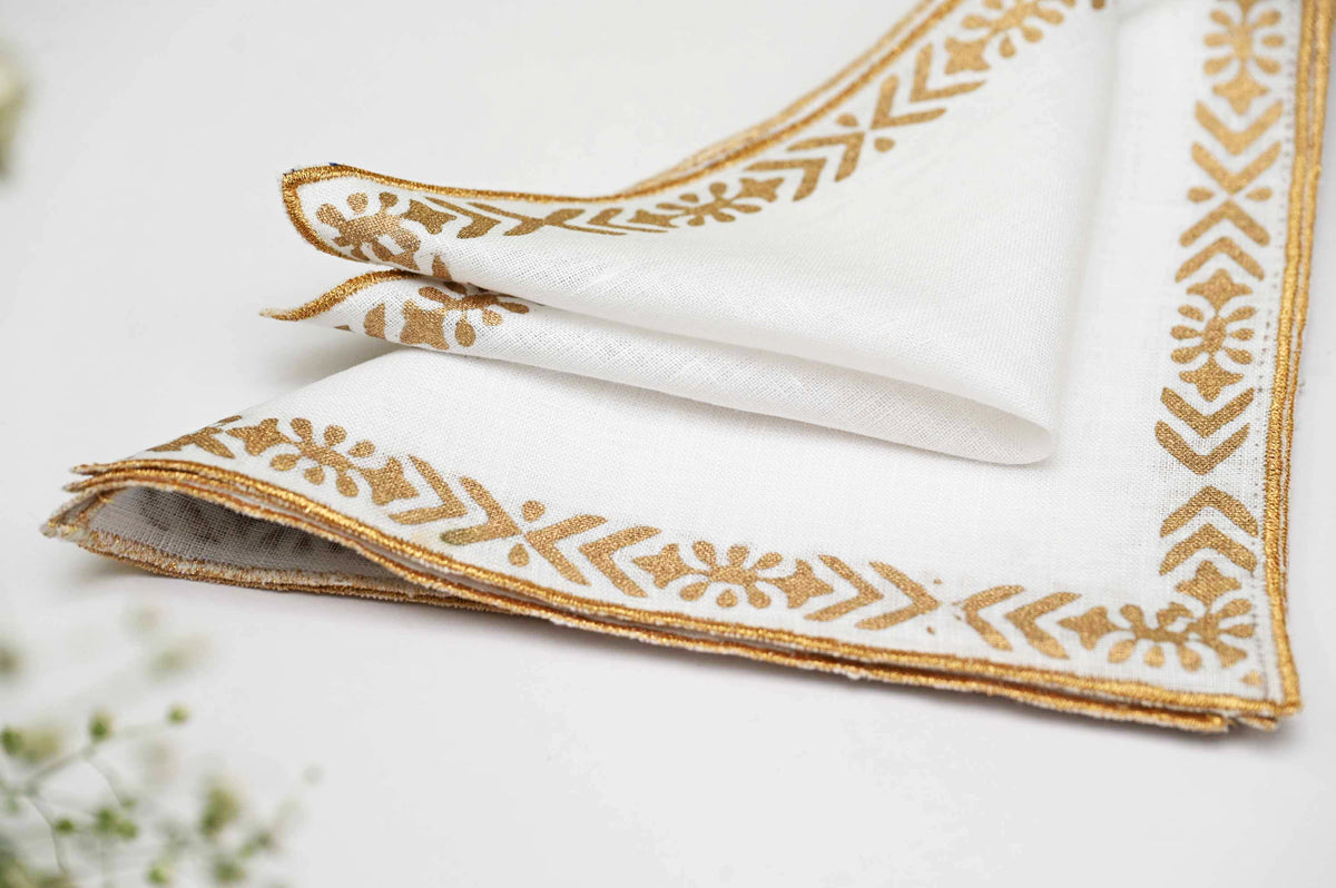 Linen cocktail napkins with line and motif.