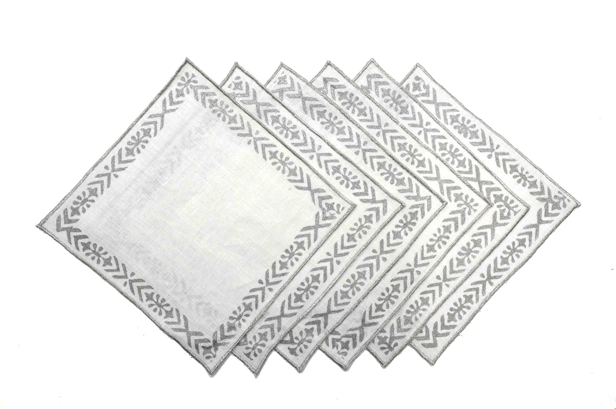Linen cocktail napkins with line and motif.