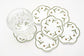 White linen round embroidered coasters.