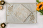 Cream embroidered linen placemats with  embroidered white napkins.