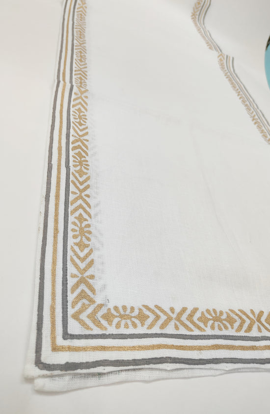 White linen runner with delicate block print.