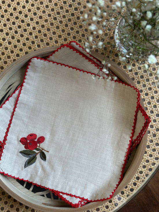 Natural linen cocktail napkins with embroidered cherries.